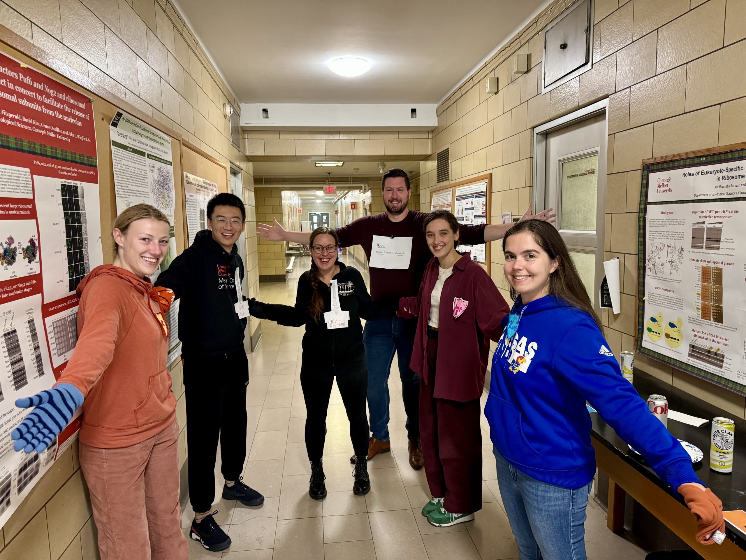 Picture of lab members in a group with matching colors between Gibson fragments.